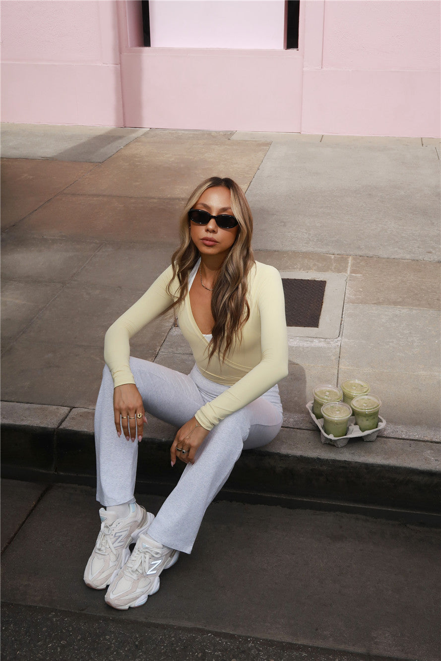 BASE Contour Ballerina Wrap Long Sleeve Crop Top Yellow
